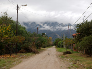 A road near Villa de Merlo, San Luis, Argentina, with the Comechingones mountains in the background.