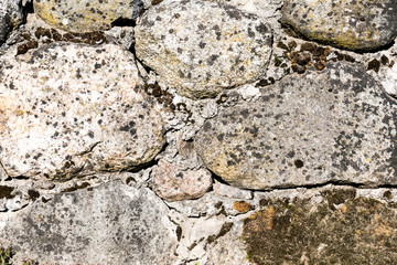 old textured and aged stone wall background