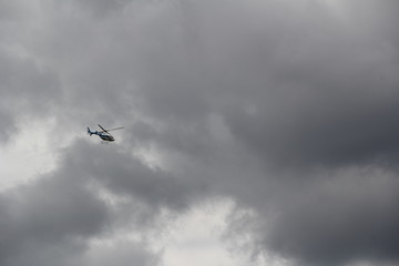 helicopter in the cloudy sky