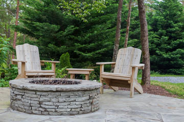 Adirondack chairs around the firepit at the farm
