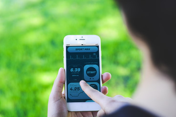 Woman checking progress with app health tracking activity on smartphone