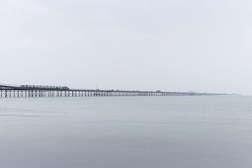old pier in foggy day