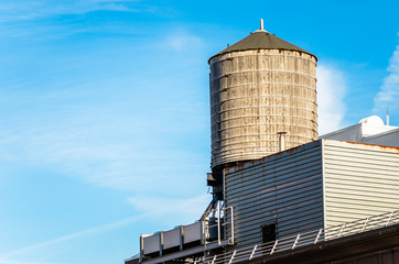 View of a Wooden Rooftop Water Tank on a Sunny Winter Morning. New York, USA.