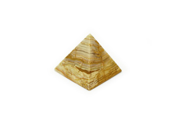 Pyramid of onyx stone with a beautiful texture isolated on white background. The pyramid architectural structure is a symbol of eternal spiritual energy made of natural stone. Souvenir polished onyx.