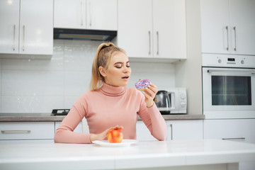 Diet. The concept of healthy and unhealthy nutrition. The model plus size makes a choice in favor...