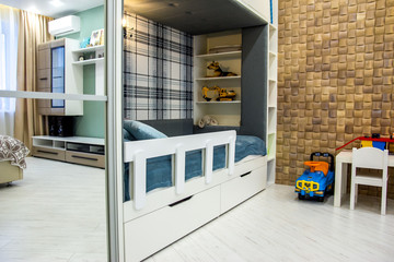 Modern interior of the house living room decor elements and segments of the luxurious environment of an empty apartment with a child kid bed