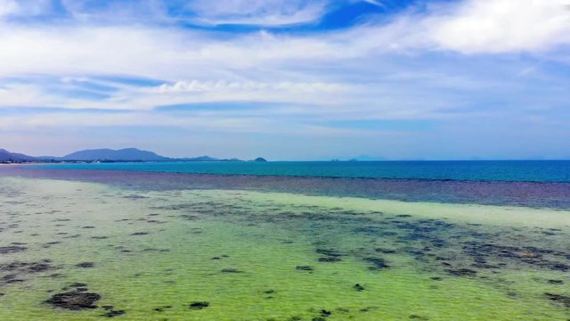 Drone Aerial Shot of Colorful Beach on Koh Samu Island Thailand WIth Different Colors of Sea Water and Beautiful Skyline