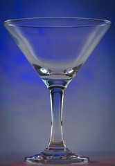 Martini Glass with dark violet lights on background