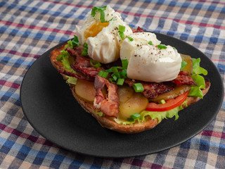 Toast with bacon, tomato ,pickle and boiled eggs