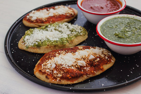 mexican tlacoyos with green and red sauce, Traditional food in Mexico
