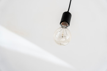 light bulb hangs from the ceiling