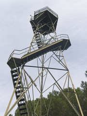 Low angle view of an old rusty steel forest fire lookout tower.