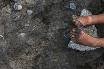 Blonde girl plays happy on the beach