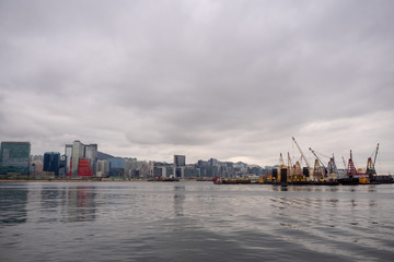 Panorama view of river, business district and crane boat on cloudy sky background and copy space
