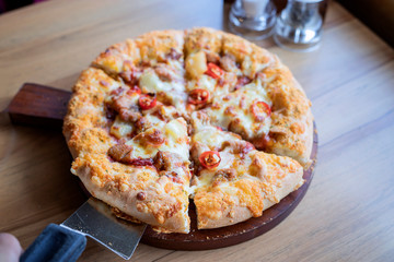 Pizza on a wooden tray