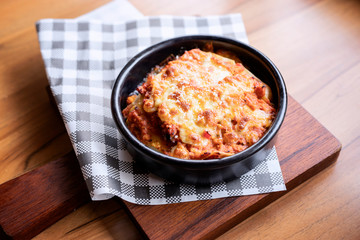 Lazanya in a black bowl