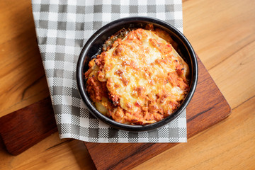 Lazanya in a black bowl