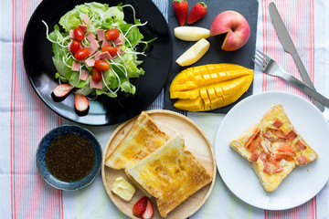 Breakfast, toast and vegetable salad with fruit