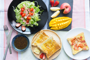 Breakfast, toast and vegetable salad with fruit