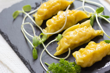 Shrimp dumplings on a rustic stone background