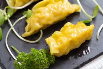 Shrimp dumplings on a rustic stone background