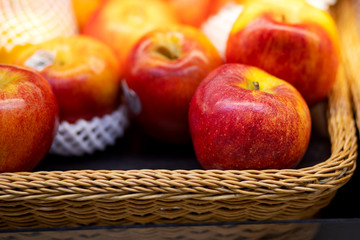 Beautiful fresh sweet red apples in basket
