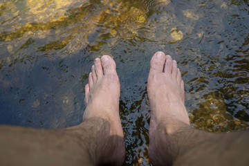 Men Feet soaked in water