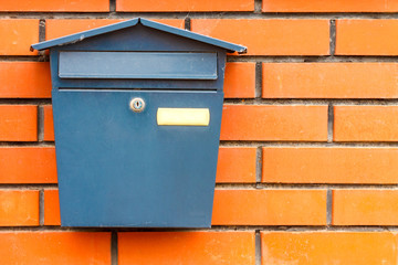 A beautiful mailbox hangs waiting for newspapers, parcels and letters.