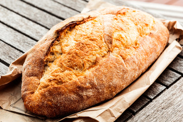 Cob bread placed carefully on outdoor table.