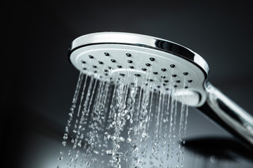 Naklejka na ściany i meble Water Flowing From Head Shower
