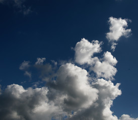 Obraz premium Magnificent white cumulonimbus cloud in blue sky. Australia.