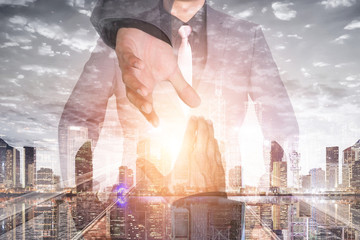 business partner hand shake with mixed media
