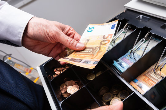 Euro Banknotes And Coins In Cash Box