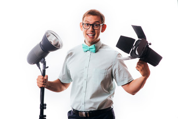 Fototapeta premium photographer in his studio setting up lights for the upcoming photoshoot