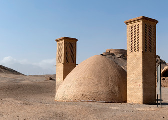 Fototapeta na wymiar Windcatchers and Water Reservoir at Zoroastrian burial grounds in Yazd, Iran