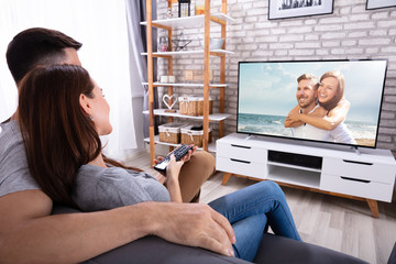 Couple Watching Television At Home