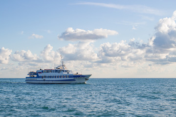 Fototapeta na wymiar Passenger ship at sea against the sky