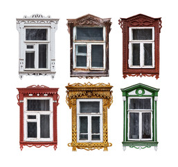 Set of windows with the wooden carved architrave in the house in the old Russian town. Isolated on the white.
