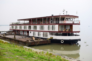 Flat bottom boat for tourism holiday on River Assam in India, Asia.