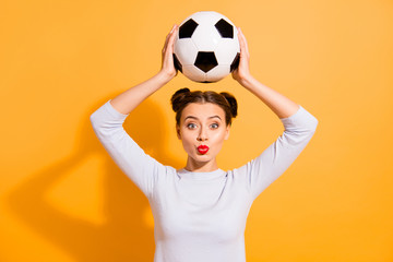 Close up photo beautiful hairdo she her lady judge referee hold raise above head hands arms leather ball send kisses players love work job wear casual white pullover isolated yellow background