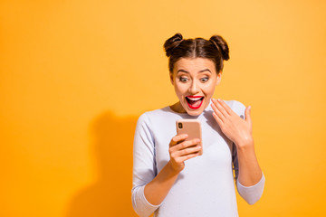 Portrait of beautiful charming girl impressed by incredible information from social networks about...