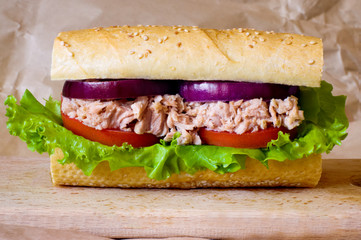 Tuna sandwich on wooden tray