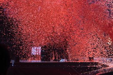 Confetti covering people on a stage
