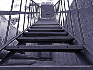 Metal stairs at a worn out residential high rise building