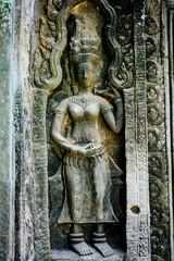 Fototapeta na wymiar Bas-relief stone carving, Angkor Wat, Siem Reap, Cambodia