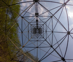 Obraz premium The pylon of the cableway that connects the towns of Albino and Selvino. Green painted pylons to camouflage them in the woods