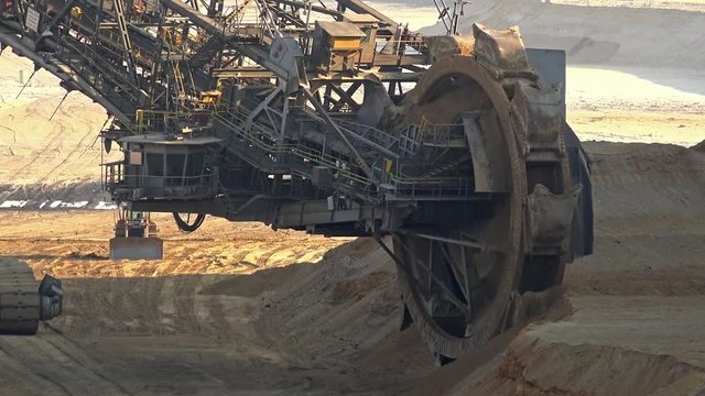 Bucket-wheel excavator in open-cast mining pit in Germany