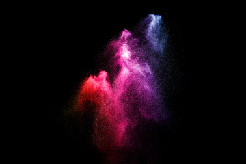 Multi color powder explosion  on black background.