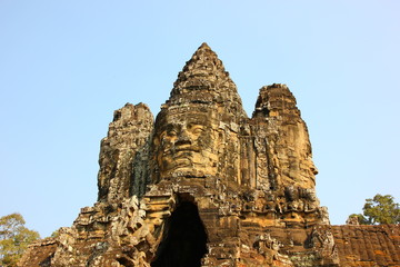 Fototapeta na wymiar smile of BAYON. BAYON castle the part of ANGKOR THOM.the specail feature is the carving of a man's face on the top of the castle.