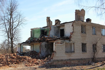 Fototapeta na wymiar Partly damaged residential brick house